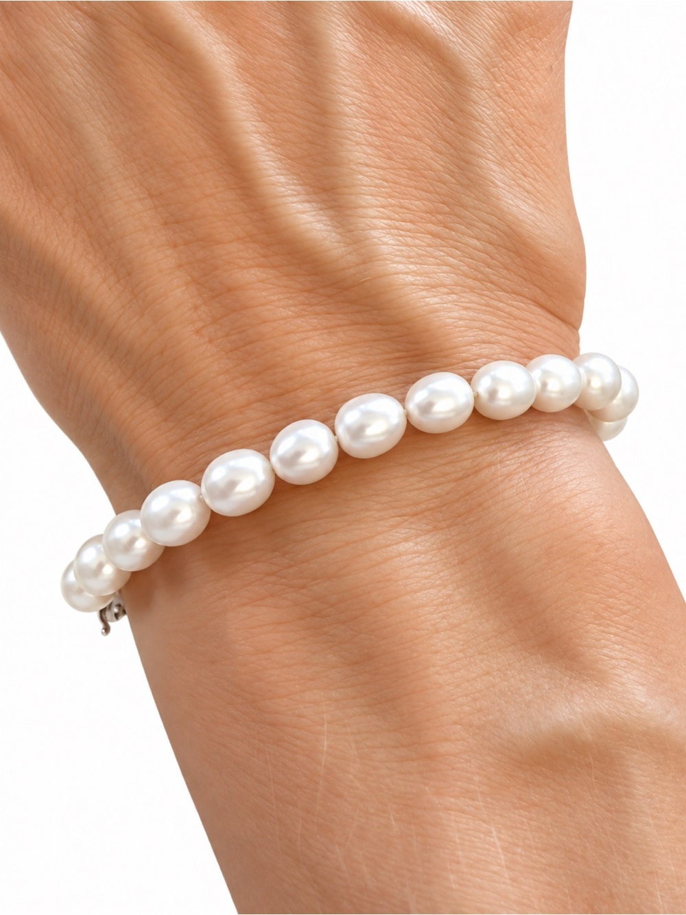 Tiffany & Co. Pearl bracelet with sterling silver infinity clasp.
